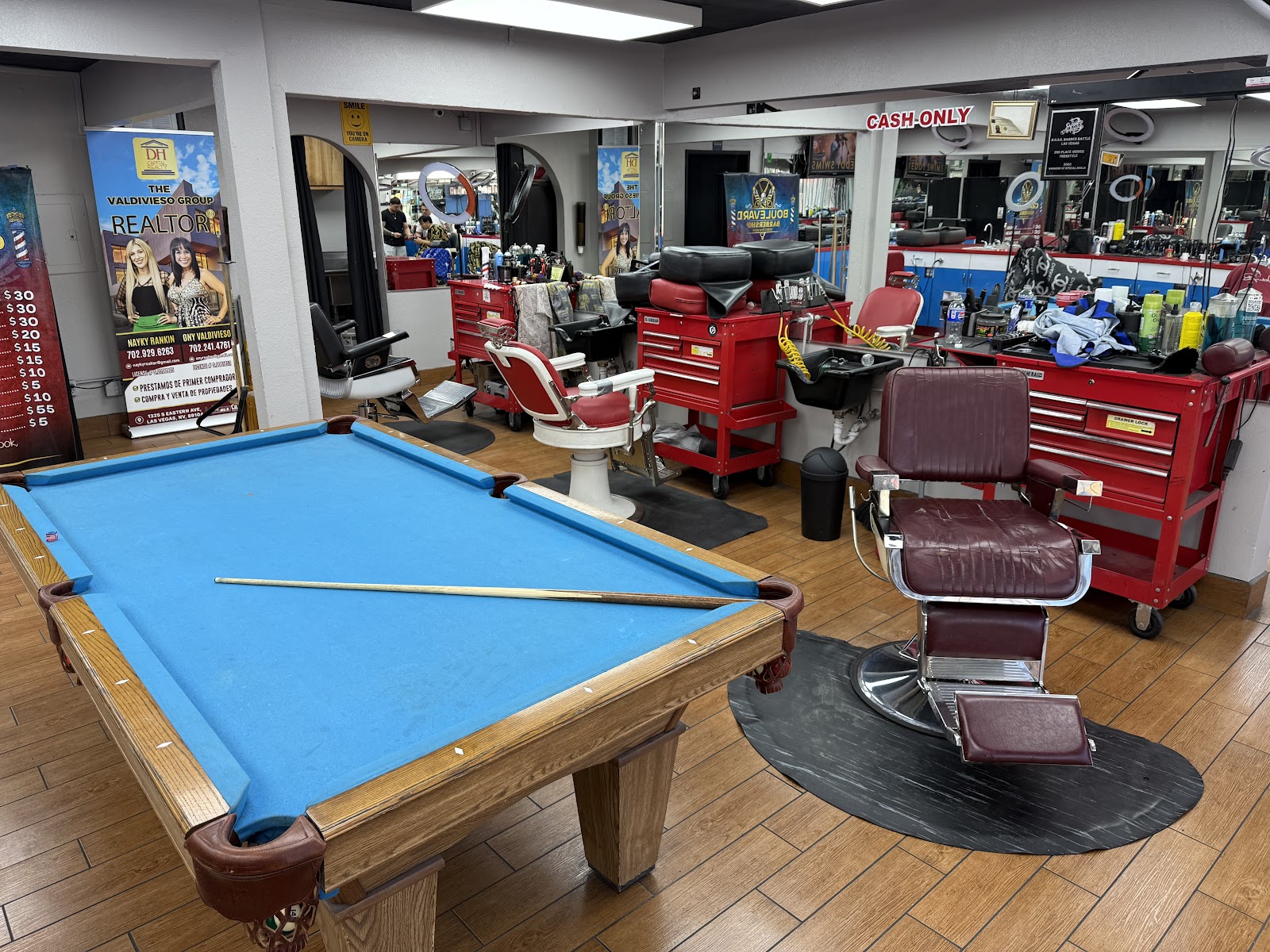 Interior of barbershop with pool table and vintage barber chairs